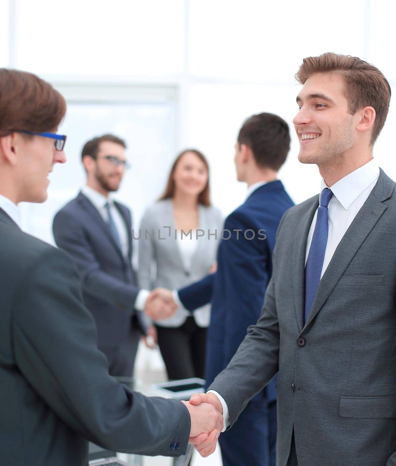 handshake of business partners after the briefing.