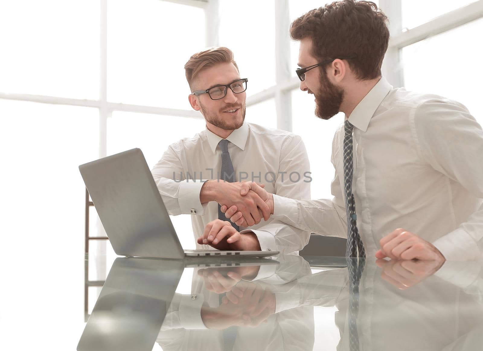 side view.business colleagues shaking hands with each other by asdf