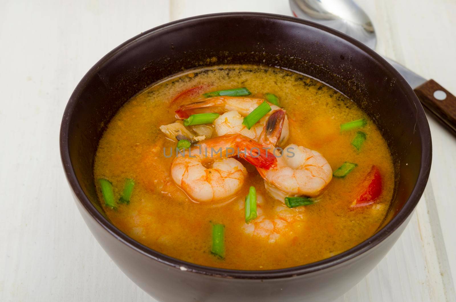 Spicy thai shrimp soup on plate. Studio Photo. by ArtCookStudio