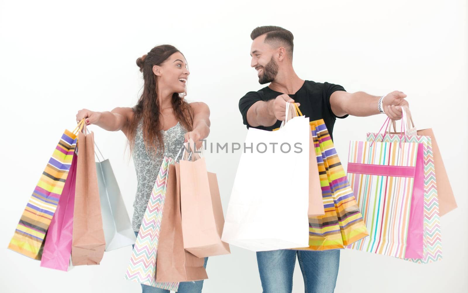 happy couple showing shopping bags.photo with copy space