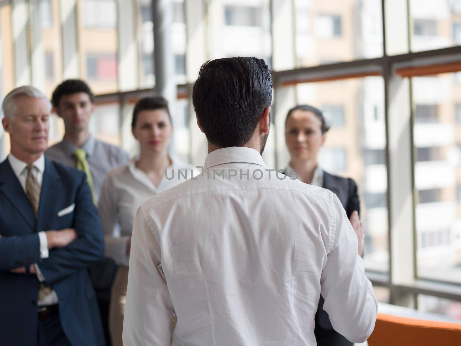 business leader working with his team, making presentation and brainstorming about ideas and projects at office