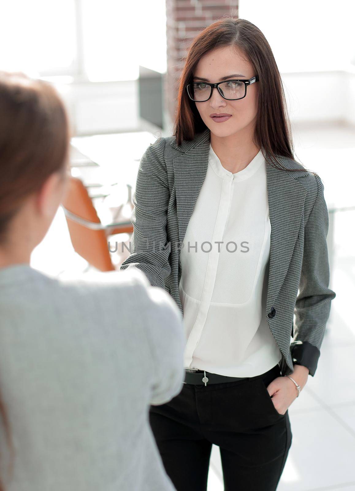 business woman meets the client with a handshake .concept of partnership