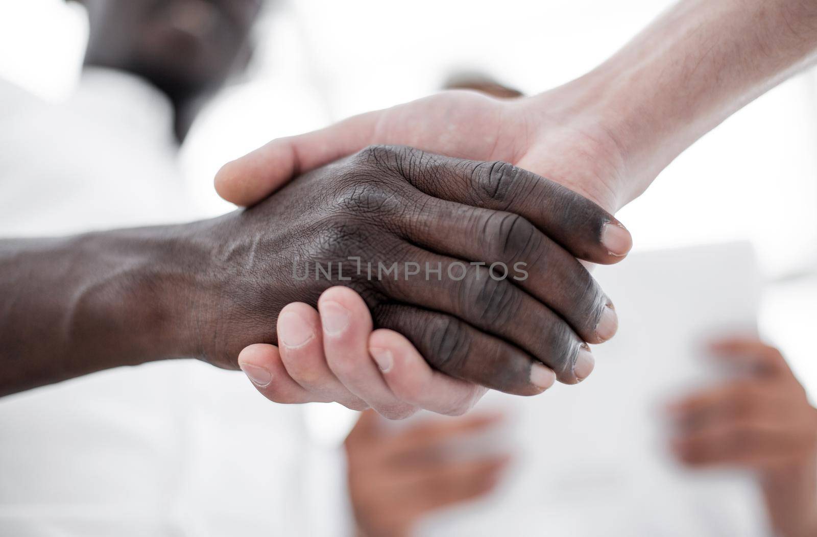 close up.handshake of international partners by asdf
