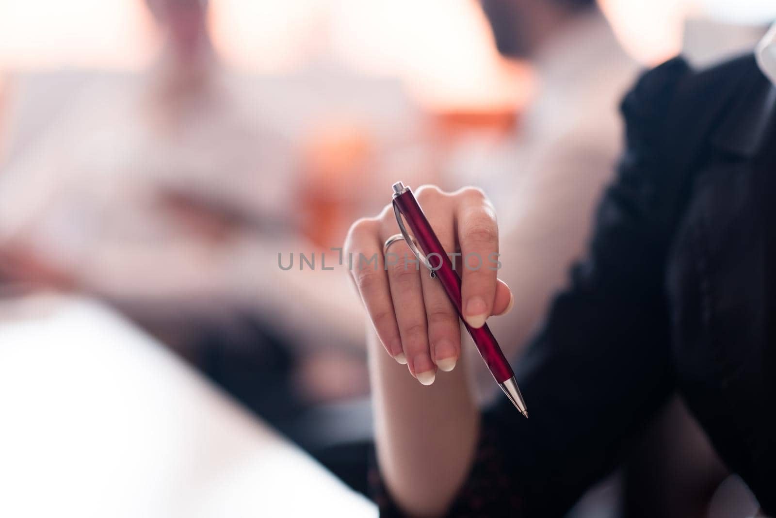 woman hands holding pen on business meeting by dotshock