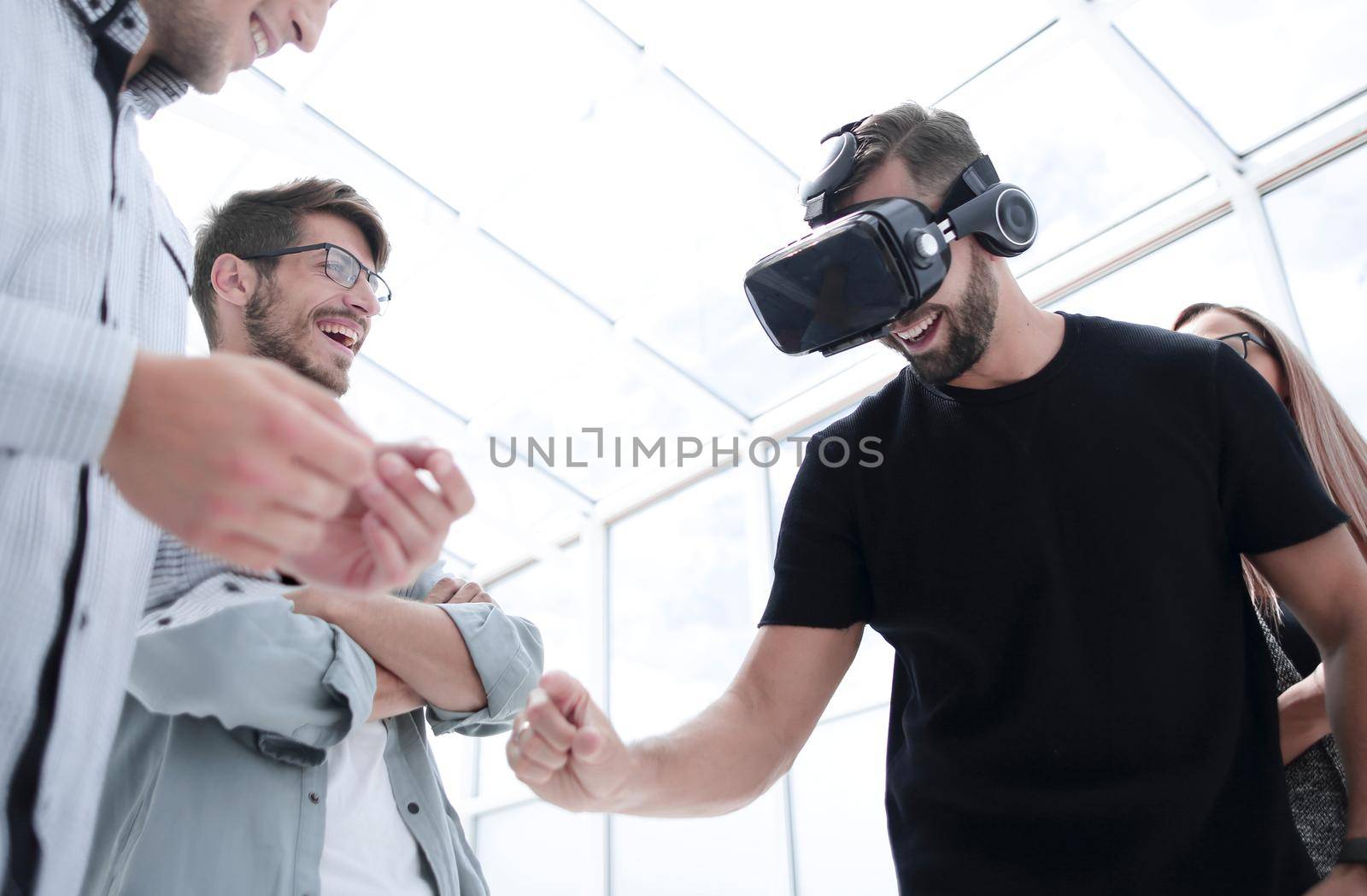 Man wearing virtual reality goggles. We by asdf