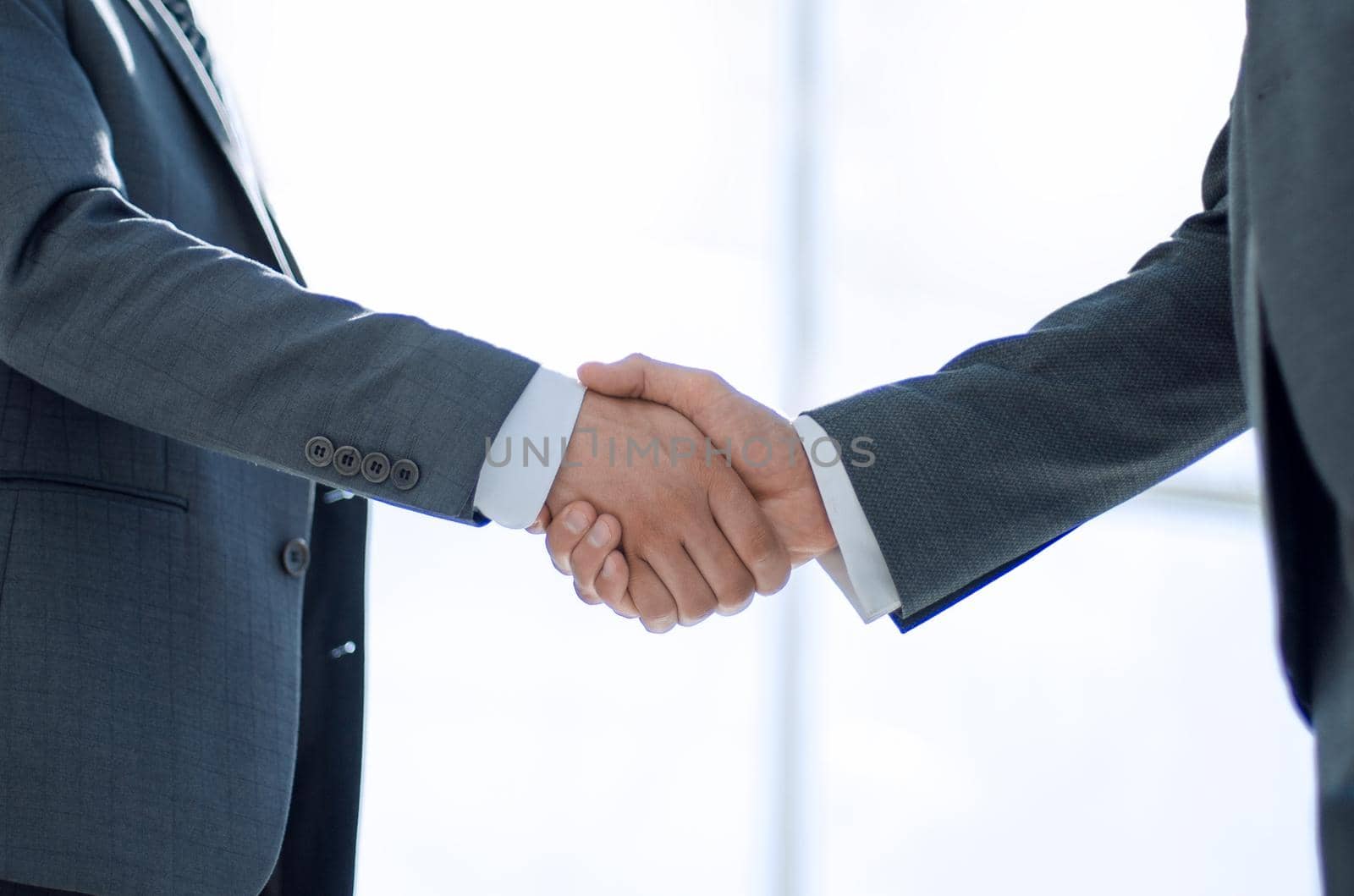 handshake of business partners on a light background.concept of cooperation