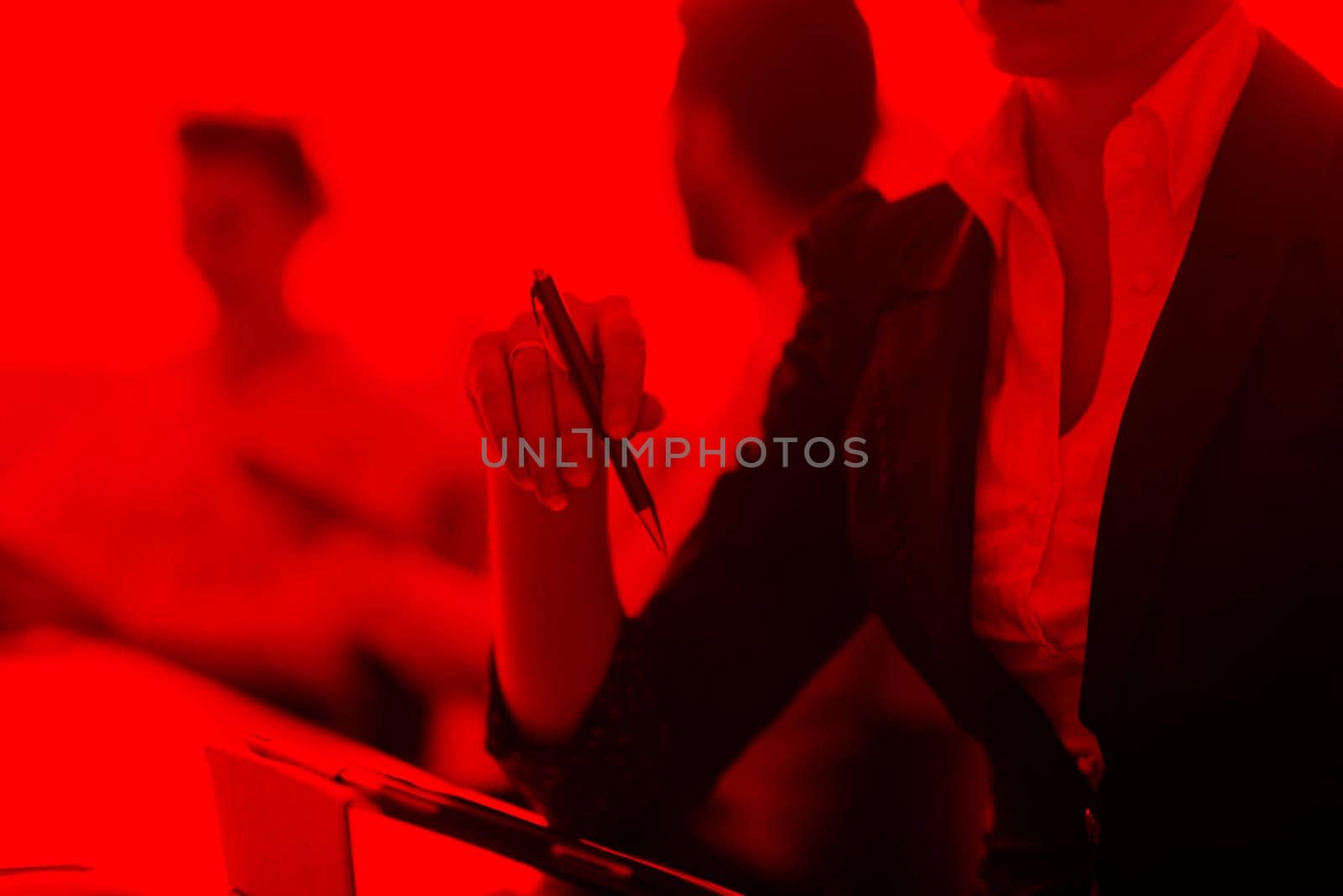 close-up of woman hands holding pen on business meeting