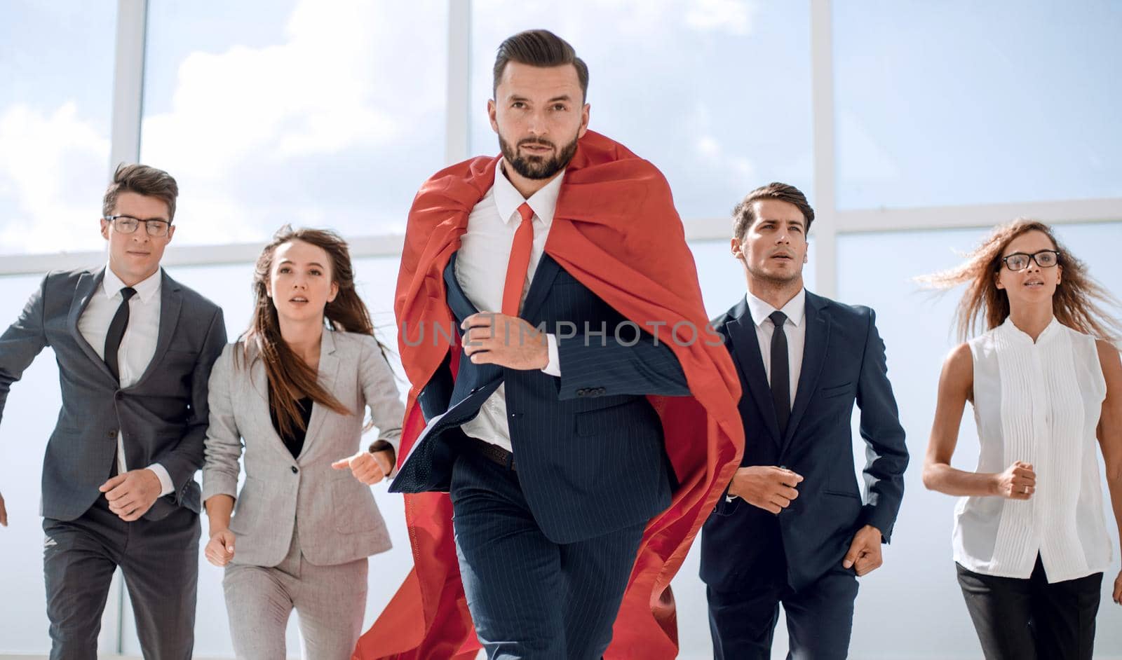 businessman superhero and his business team are stepping together.photo with copy space