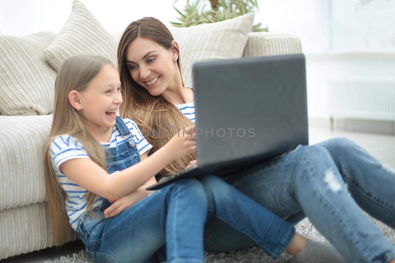 mother and daughter spend their free time together.people and technology