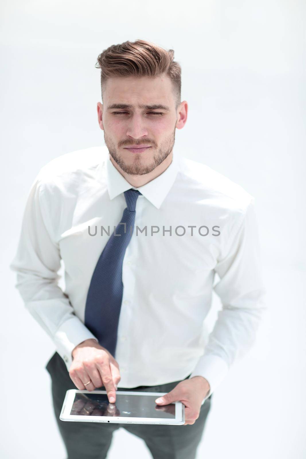 Confident man in shirt and tie with digital tablet.people and technology