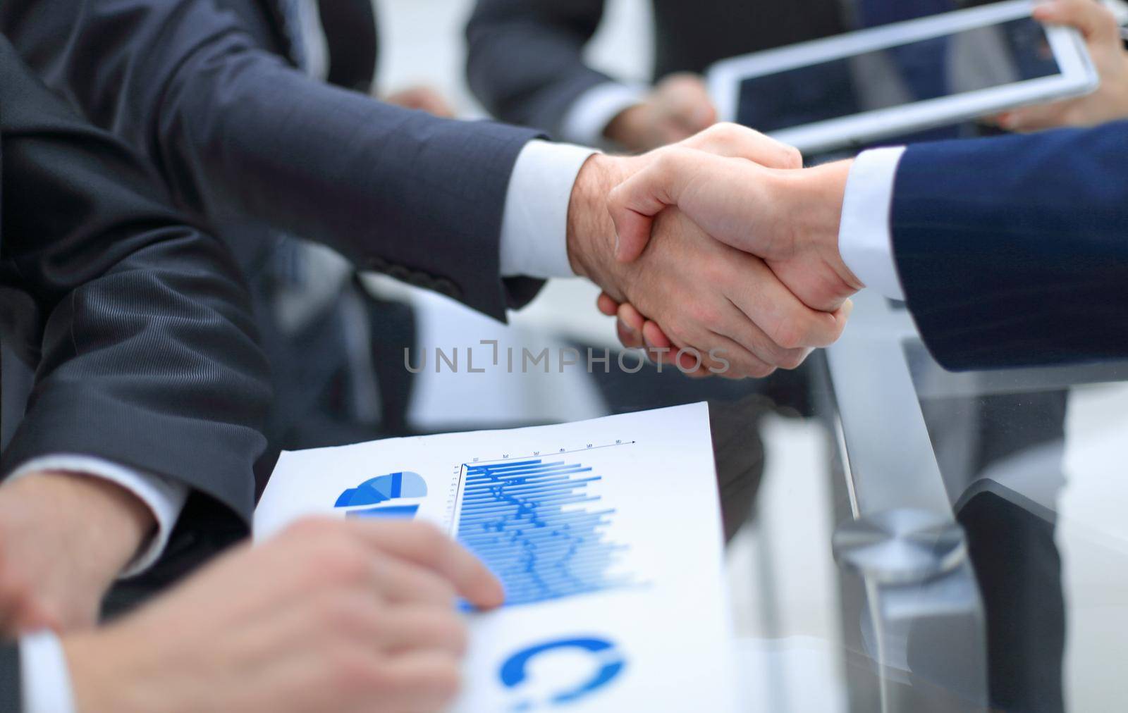handshake business colleagues in office