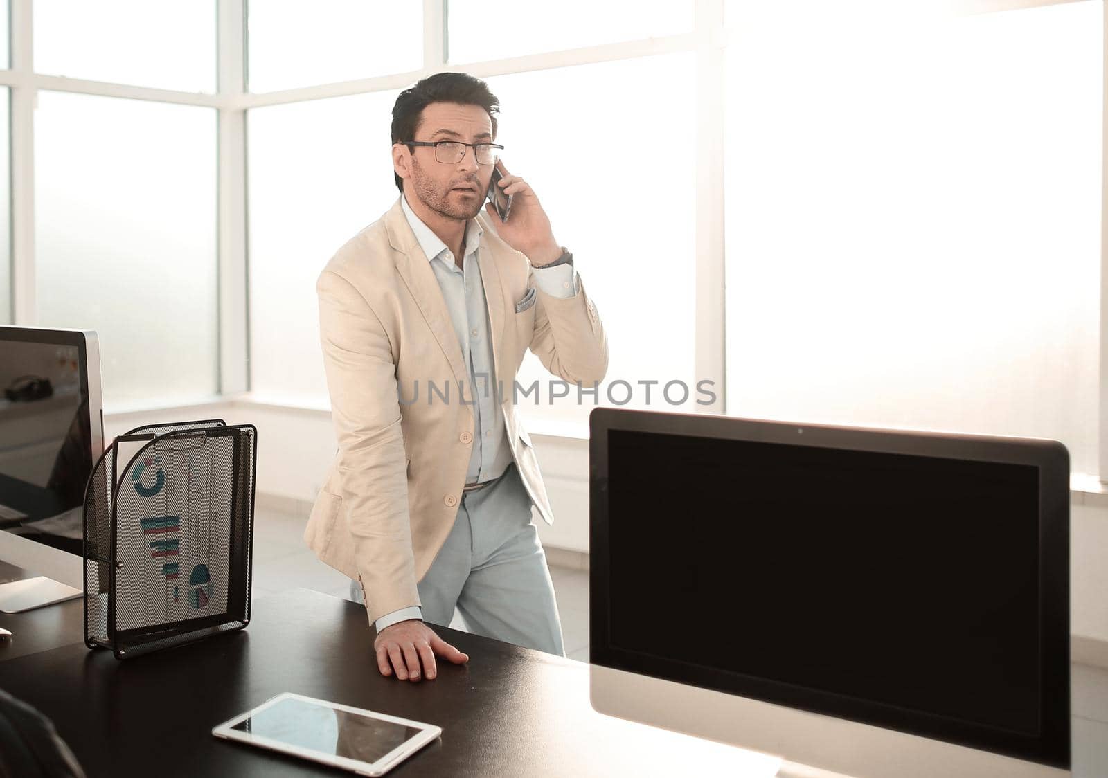 background image of a businessman in a modern office. by asdf