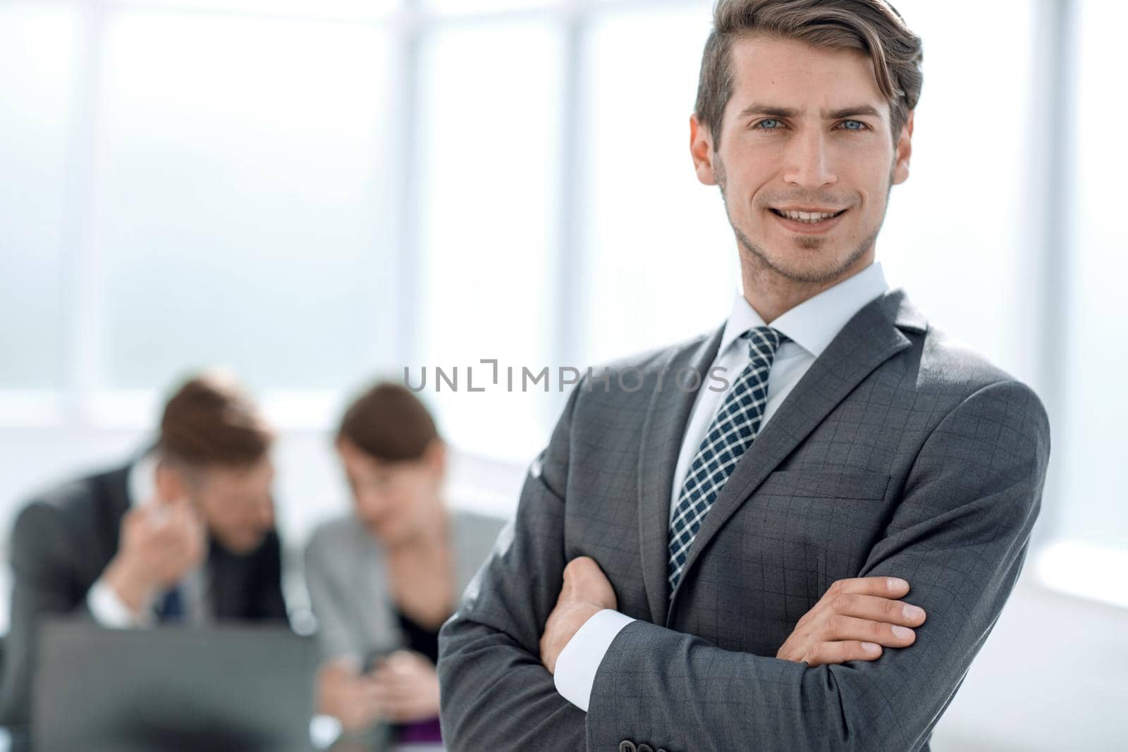 confident businessman standing in the office.photo with copy space