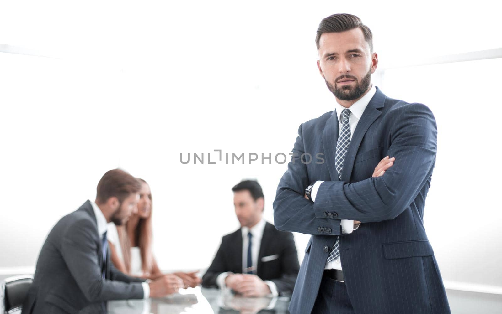 modern businessman standing in a bright office by asdf