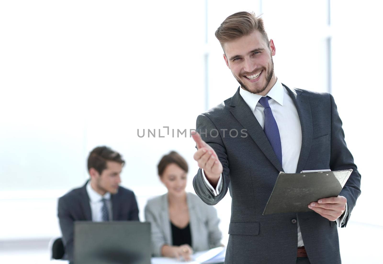friendly businessman inviting to his office by asdf