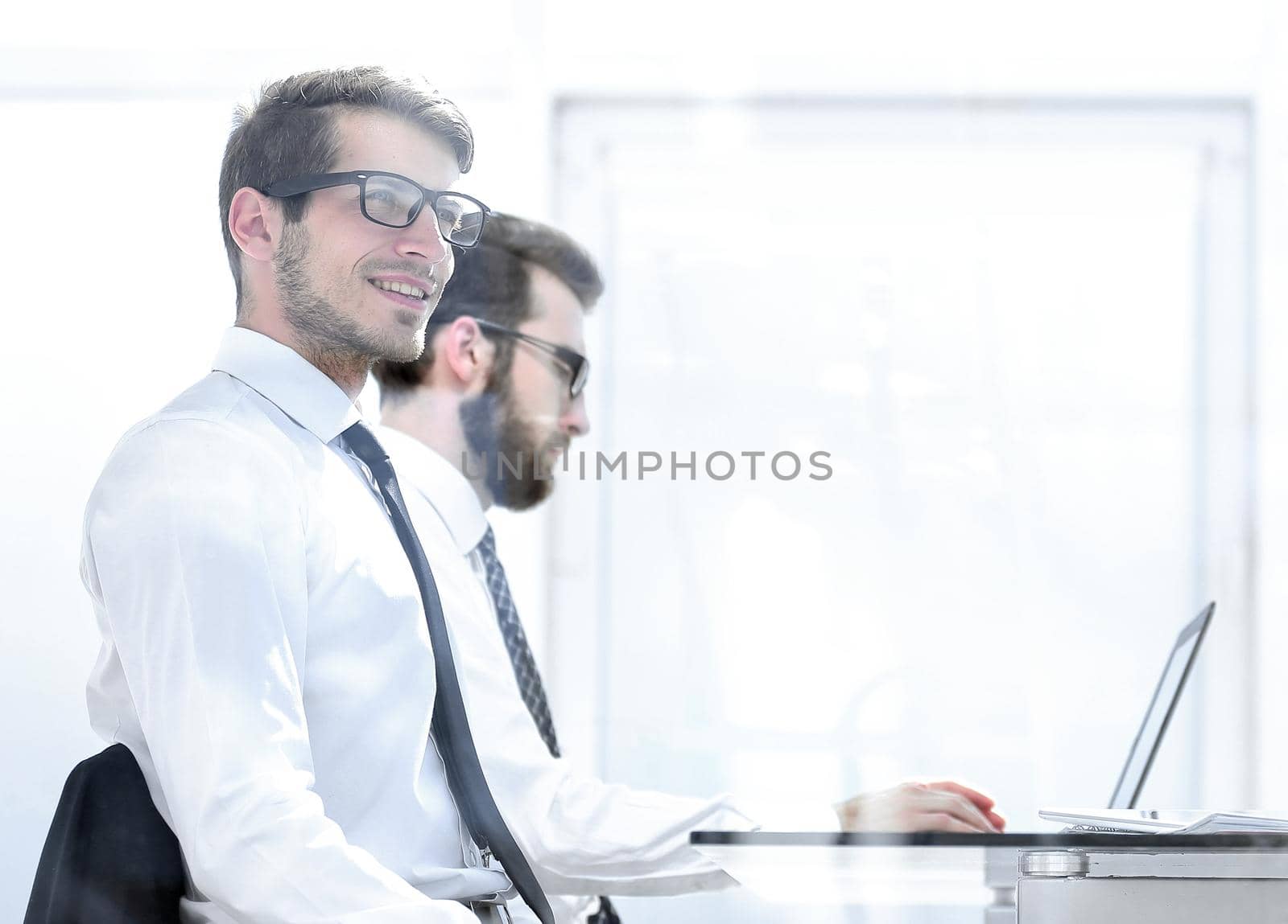 business colleagues sitting at a Desk in a bright office.photo with copy space