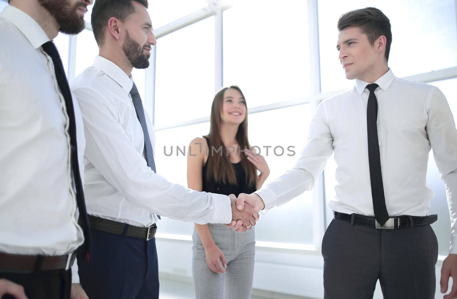 handshake between business colleagues in the office by asdf