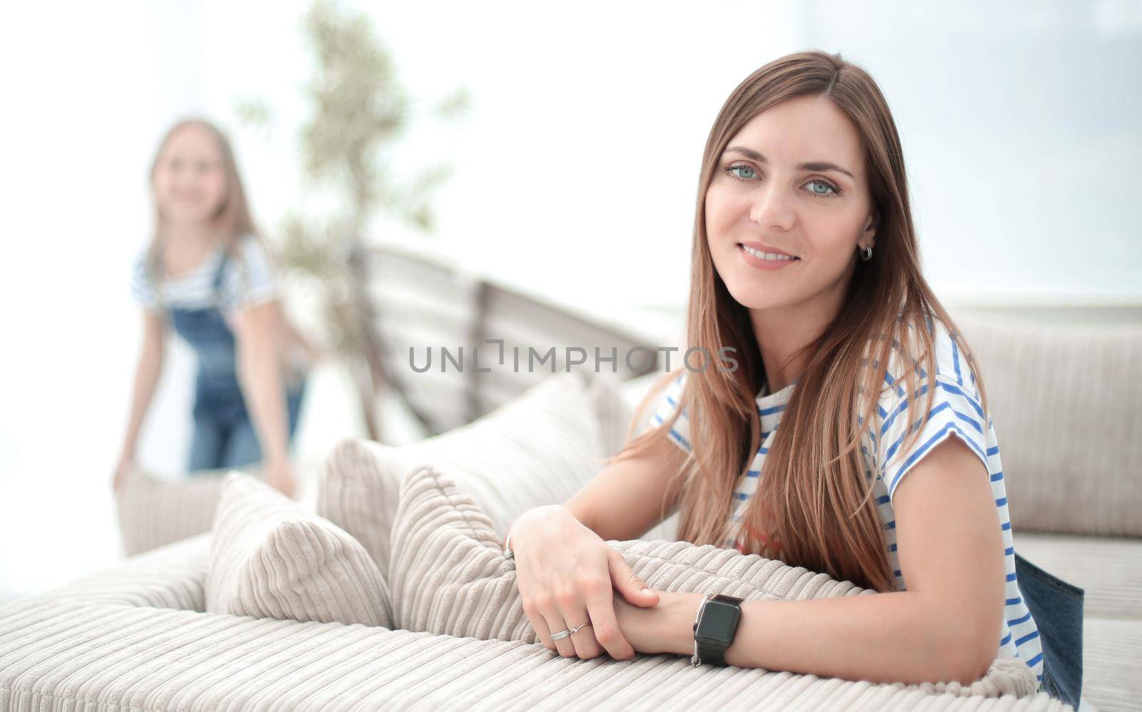 young woman on the background of a spacious living room.photo with copy space