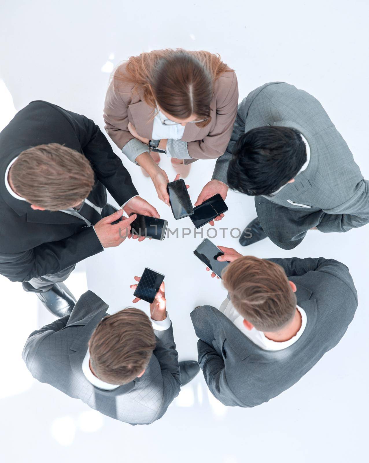 top view .business team using their smartphones.people and technology