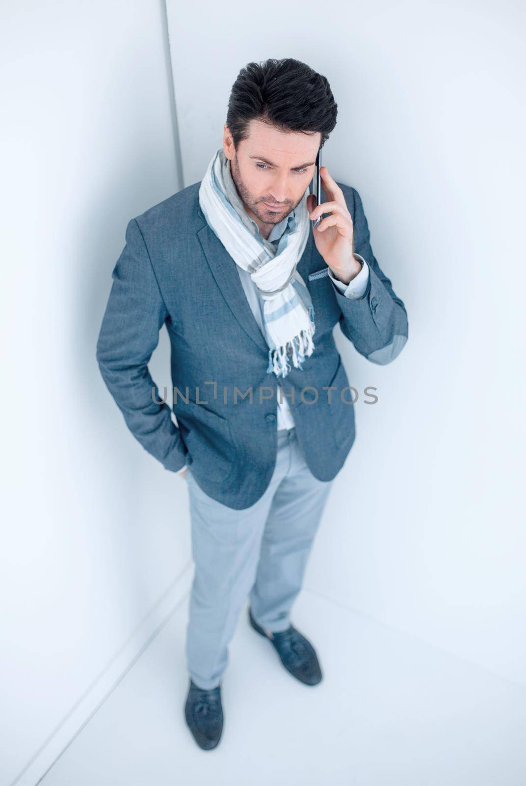 serious business man talking on mobile phone by asdf