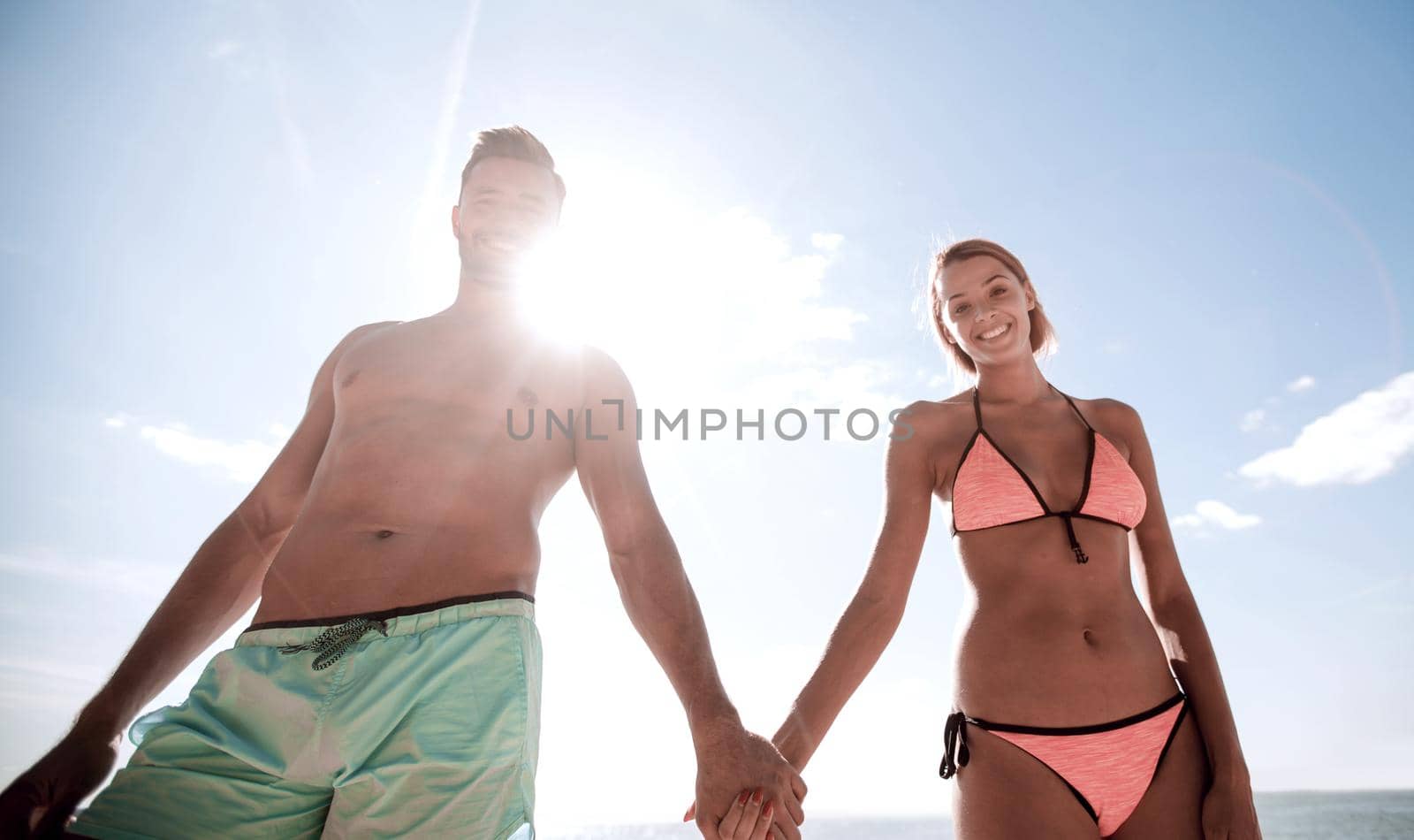 Happy loving couple enjoy tropical beach. by asdf