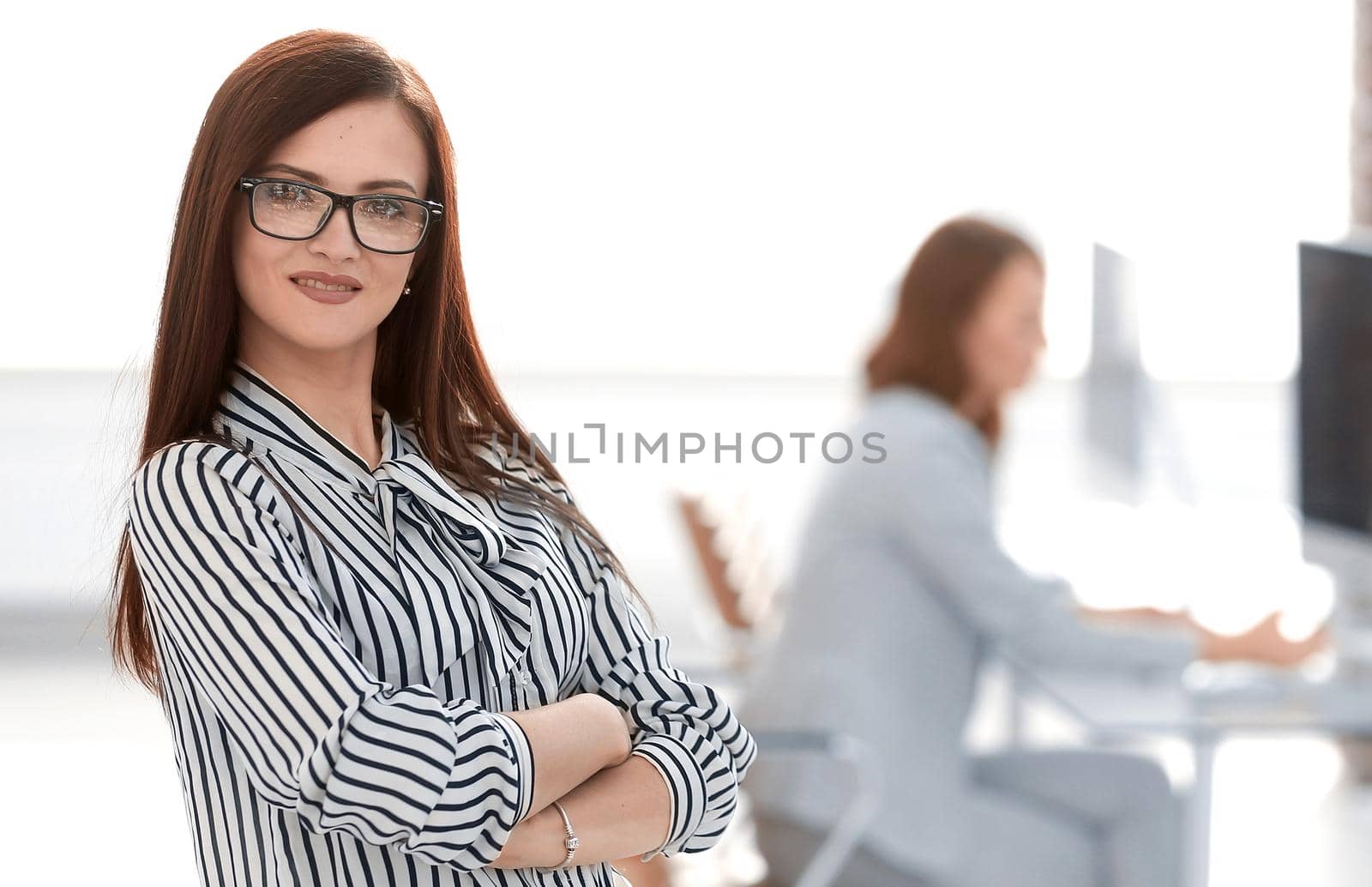 successful business woman on the background of her office.photo with copy space