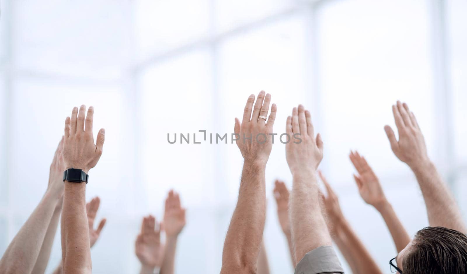 business background.the business team stands with their hands up.photo with copy space