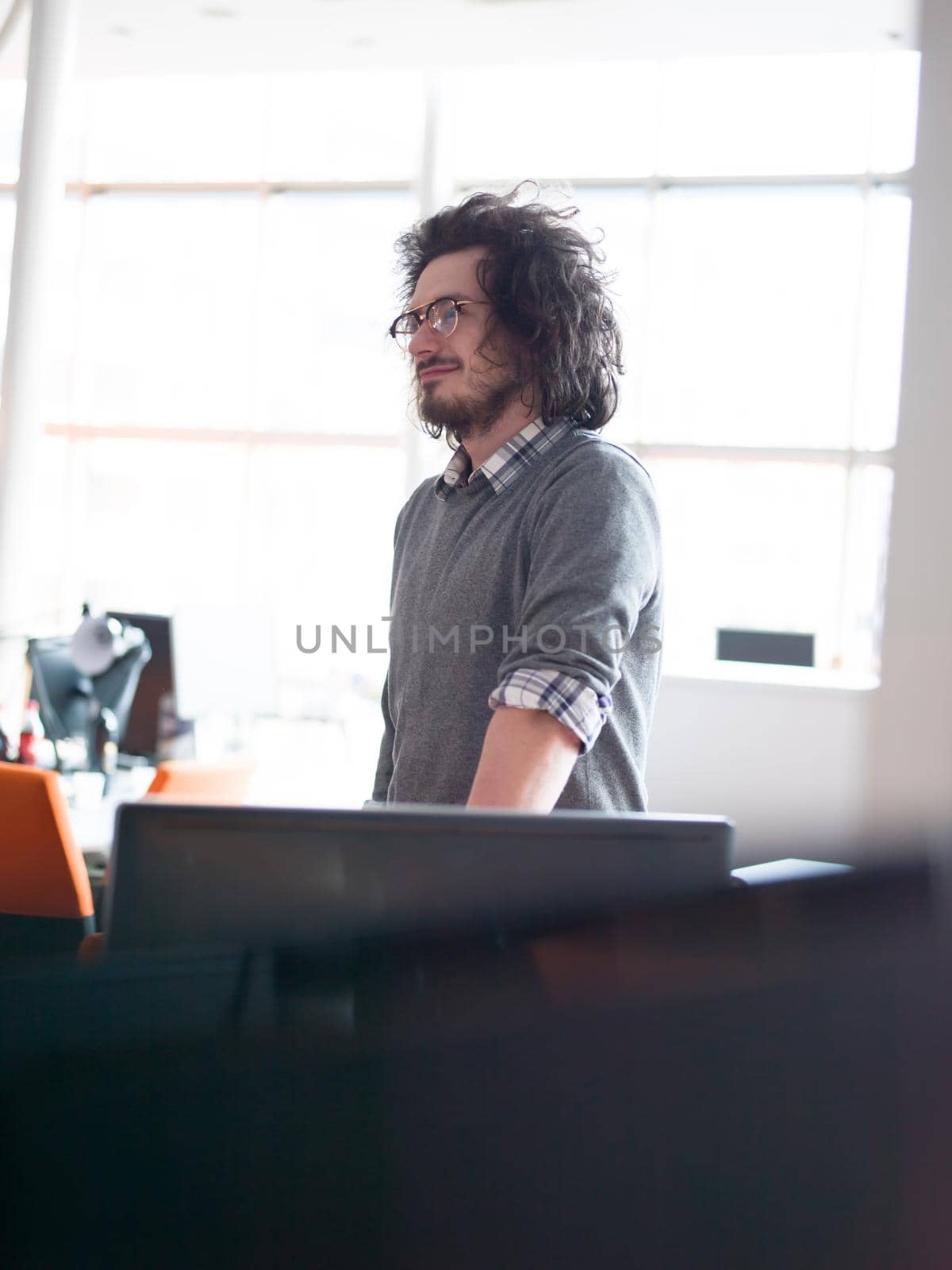 young businessman in startup office by dotshock