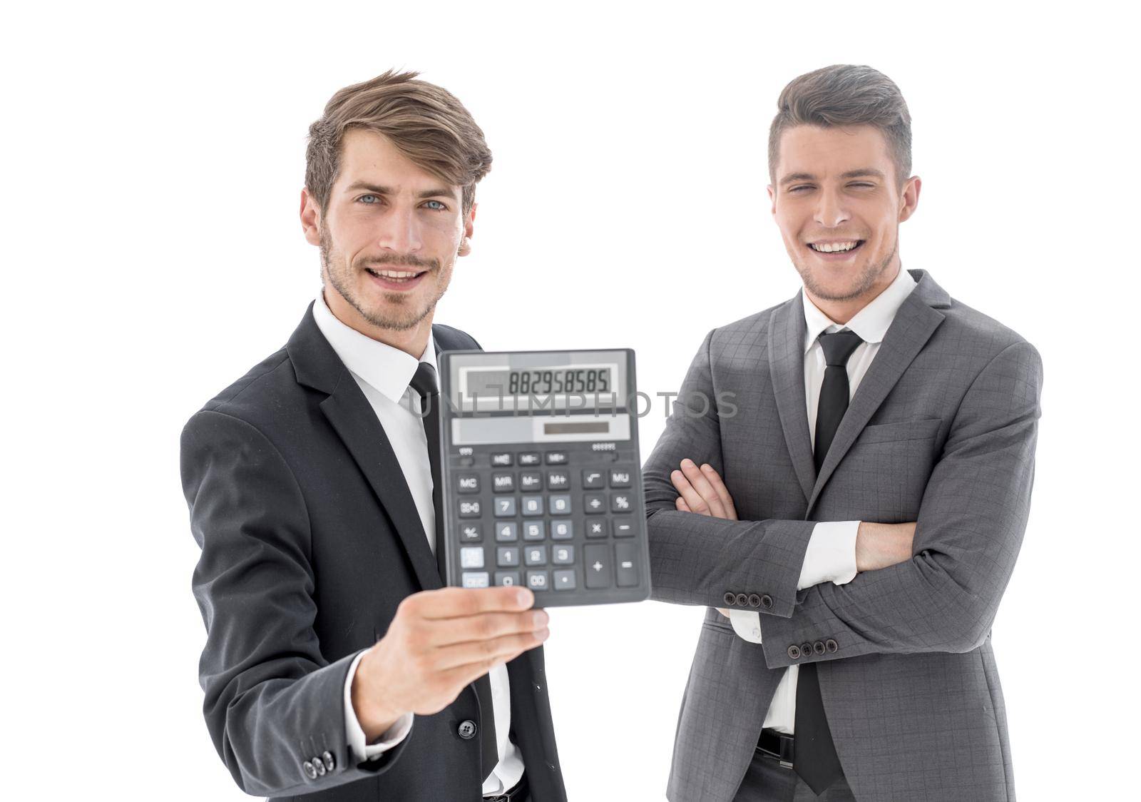 two young people holding a calculator and smiling. white background behind