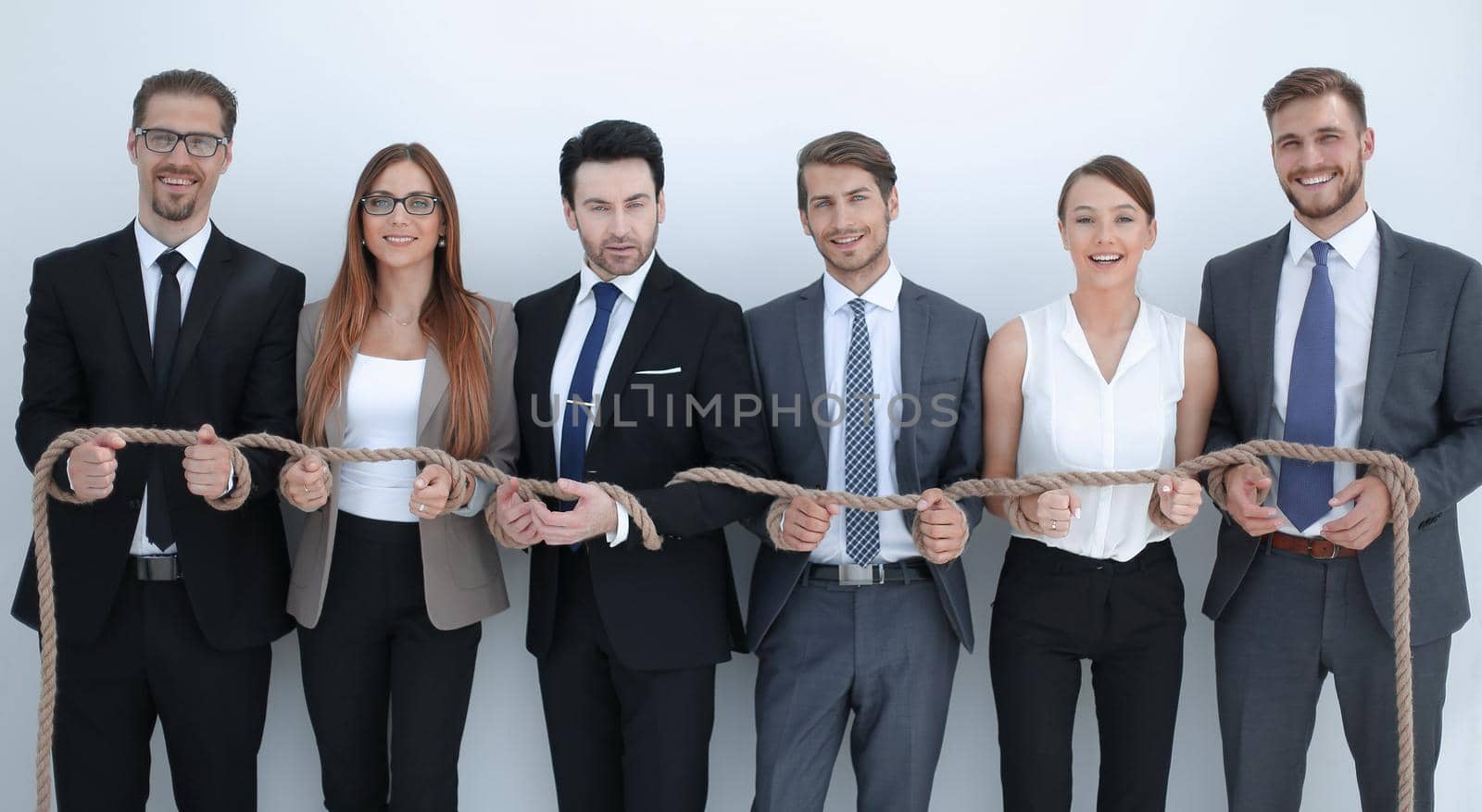 business team tied with sturdy rope .photo with copy space