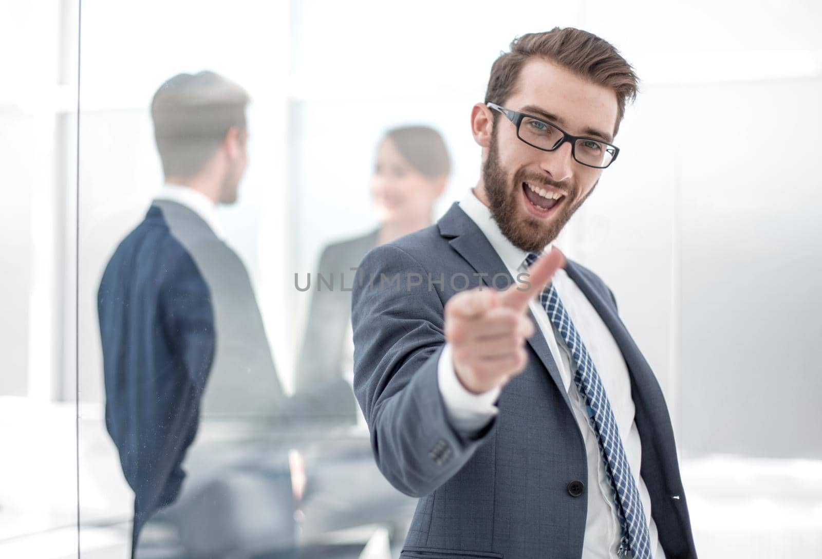 happy businessman pointing at you.the concept of choice.