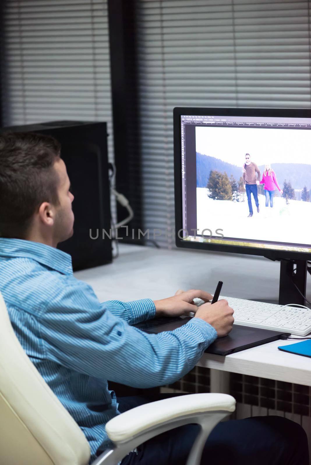 photo editor at his desk by dotshock