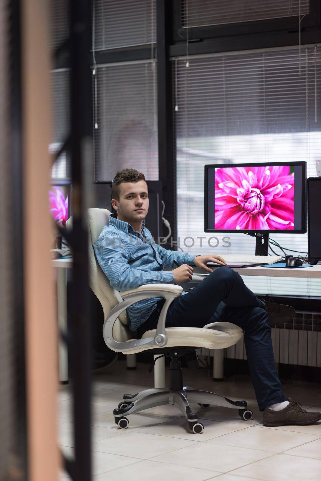 photo editor at his desk by dotshock