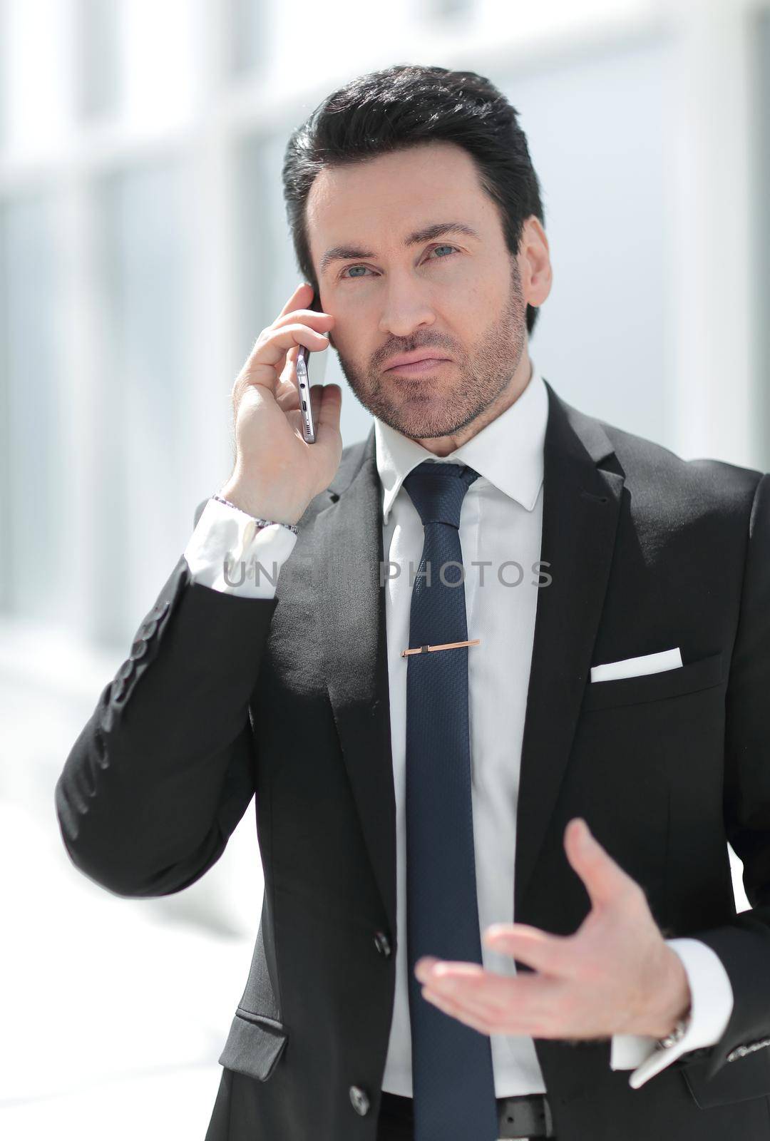 responsible businessman talking on a mobile phone.people and technology