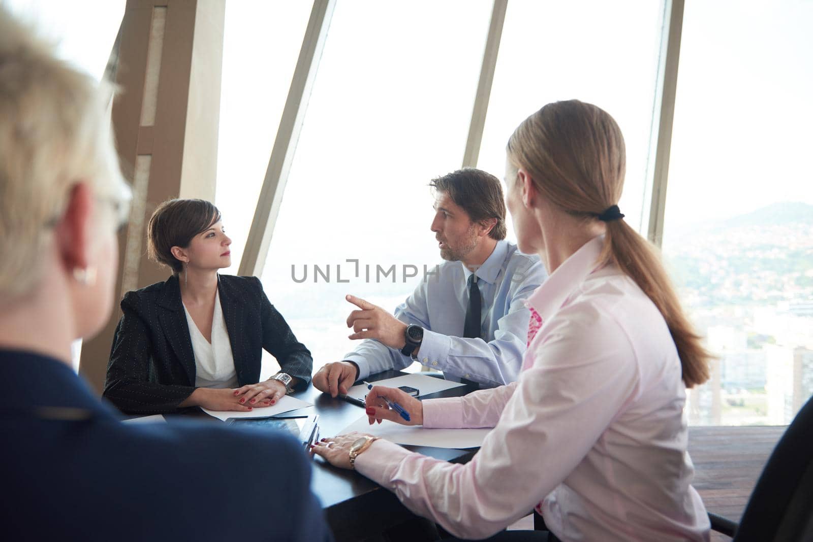 business woman on meeting, people group in background at modern bright office indoors