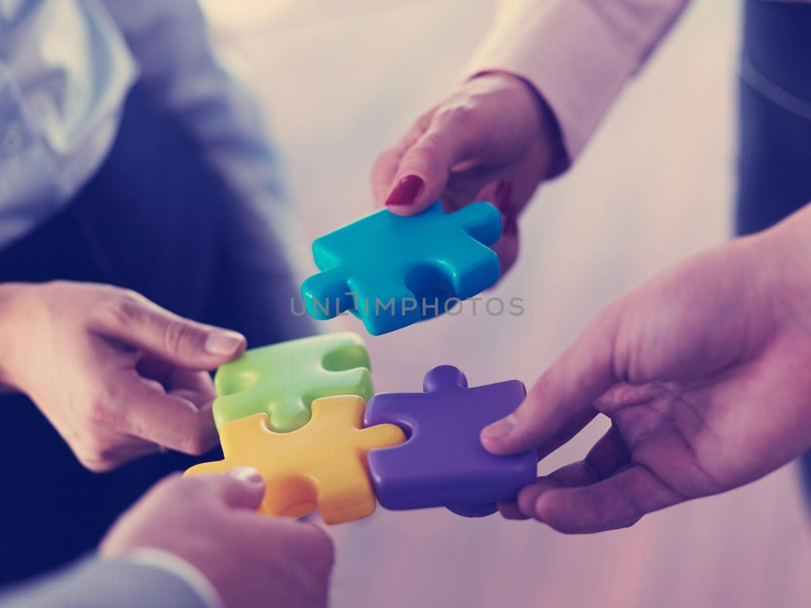 business people group assembling jigsaw puzzle by dotshock