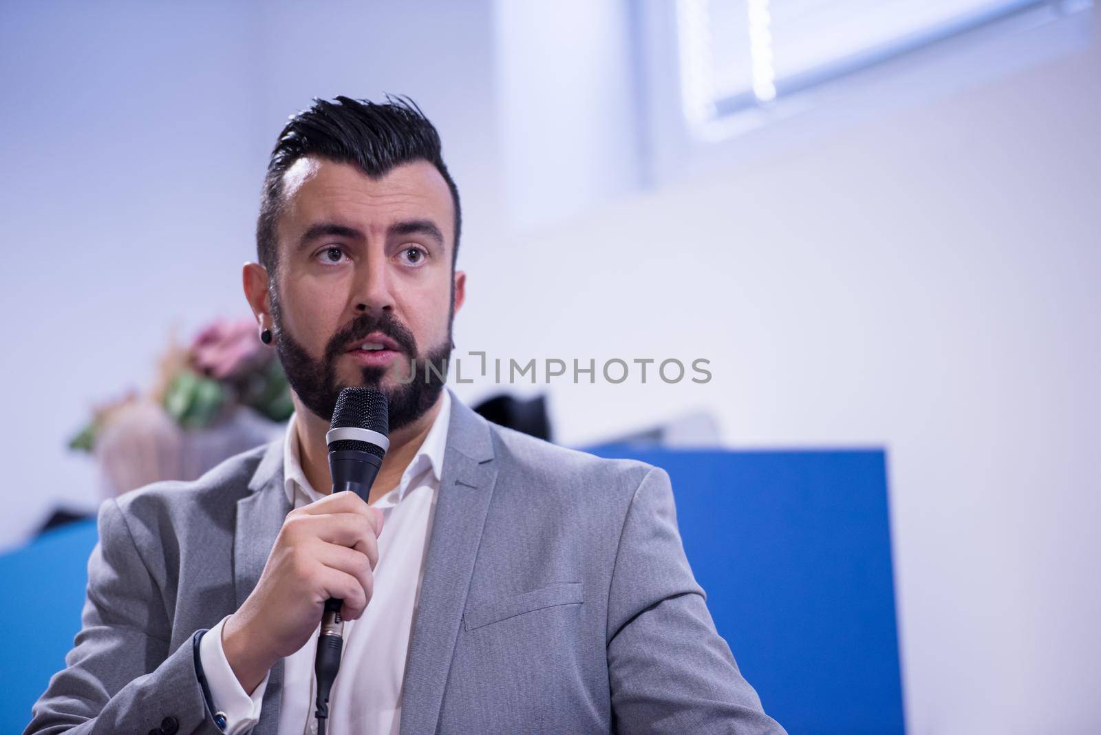 successful businessman giving presentations at conference room by dotshock