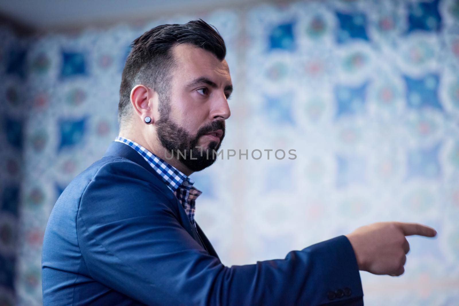 young successful businessman at business conference room with public giving presentations. Audience at the conference hall. Entrepreneurship club