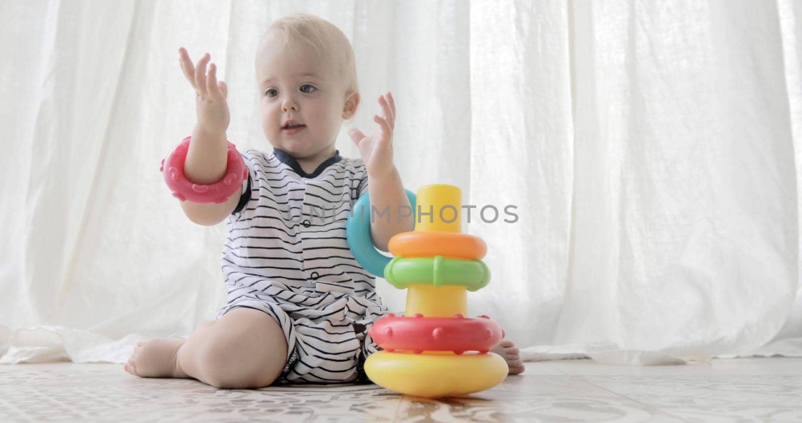 Adorable baby playing with toys by Demkat