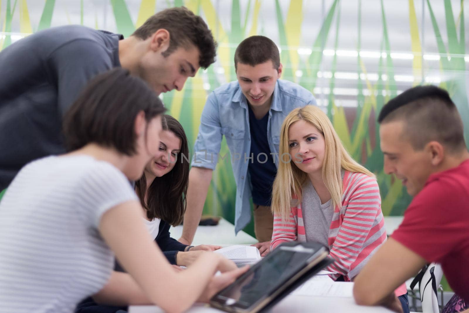 students group study together in school classroom and working together homework project