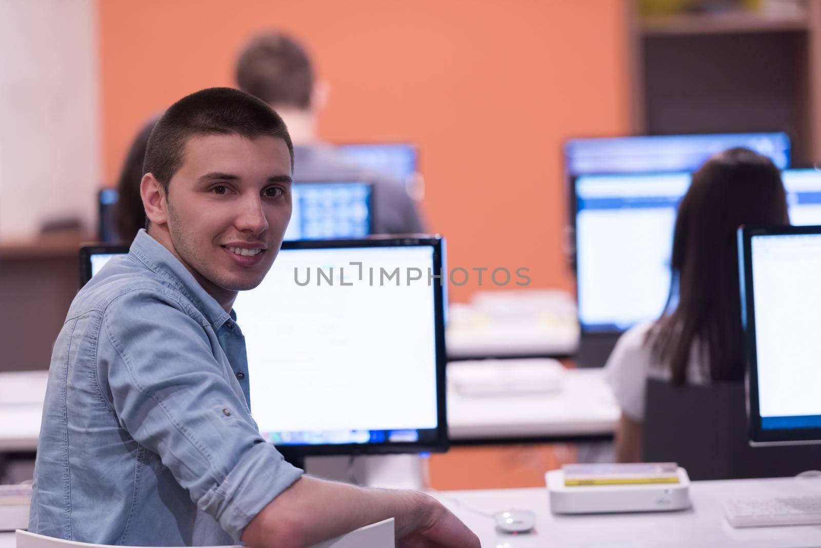 technology students group in computer lab school  classroom by dotshock