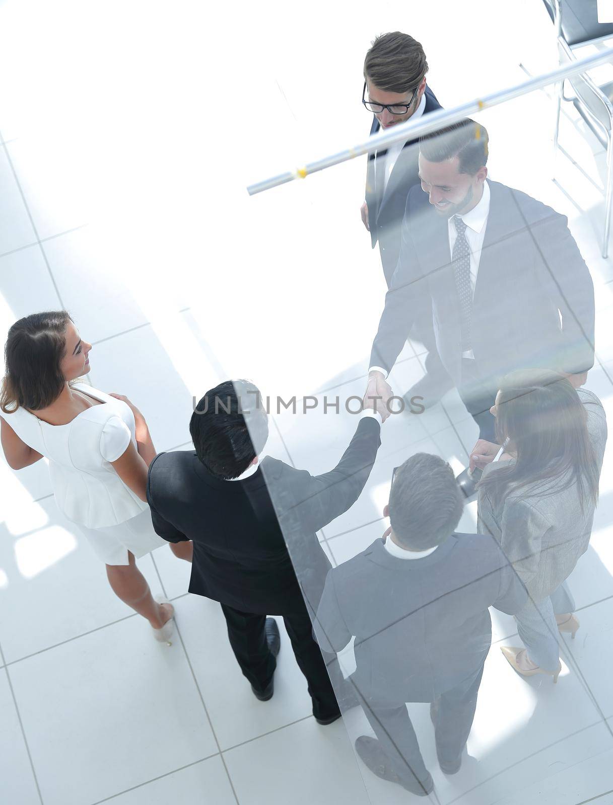 handshake business men in the circle of employees. by asdf