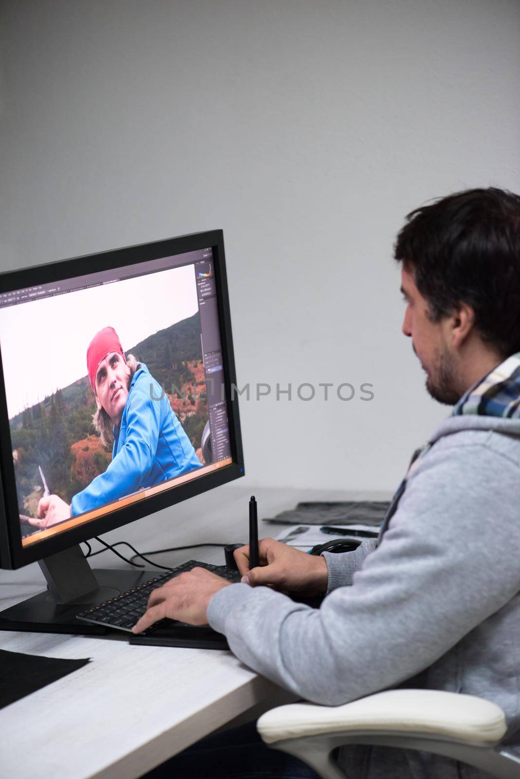 photo editor at his desk by dotshock