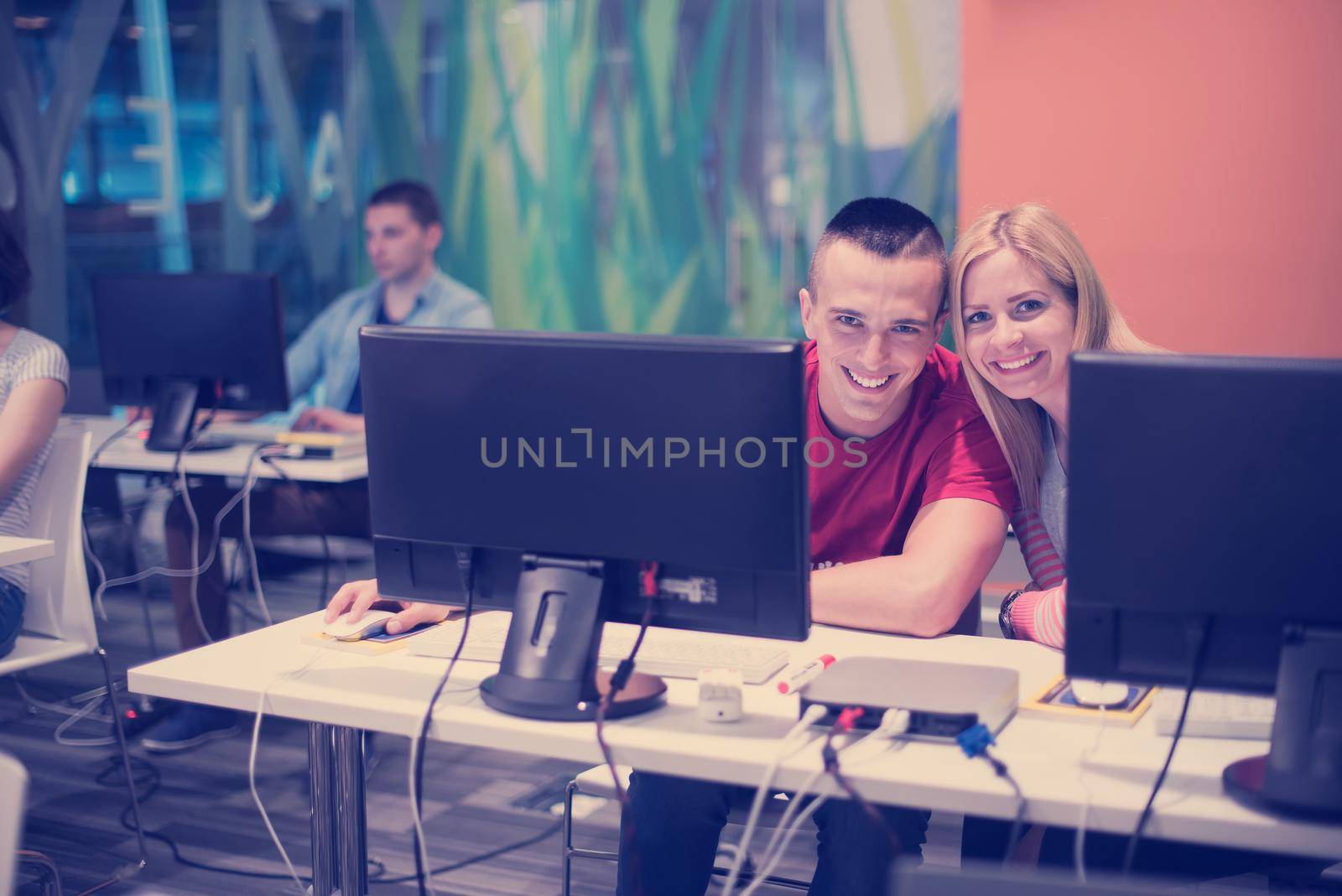 technology students group in computer lab school  classroom by dotshock