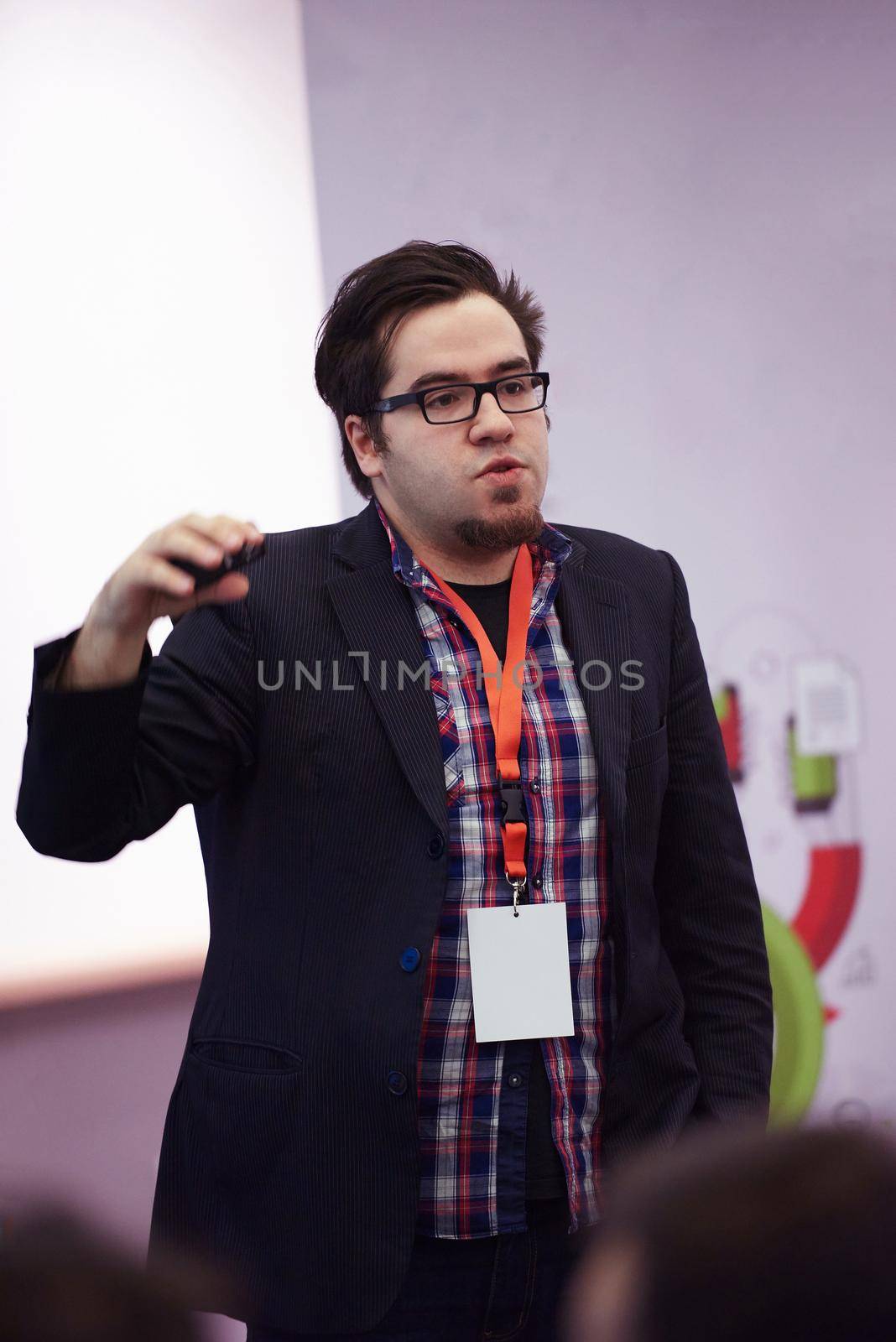 speaker on education conference presentation at modern startup interior