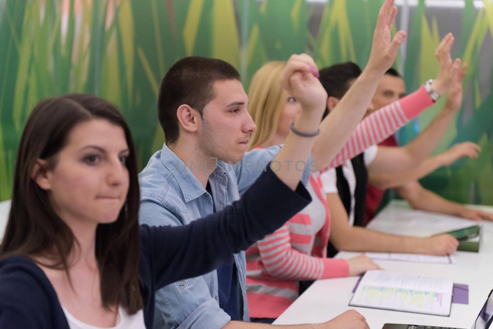 teacher teaching lessons, smart students group raise hands up in school  classroom