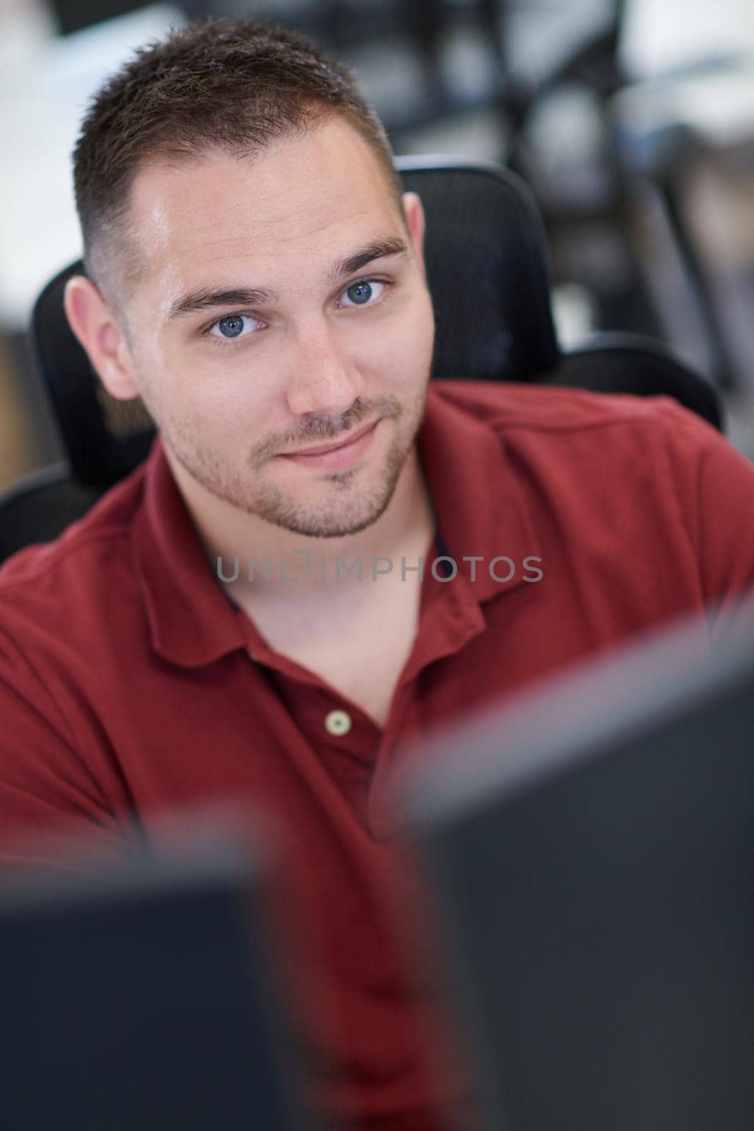 casual business man working on desktop computer by dotshock