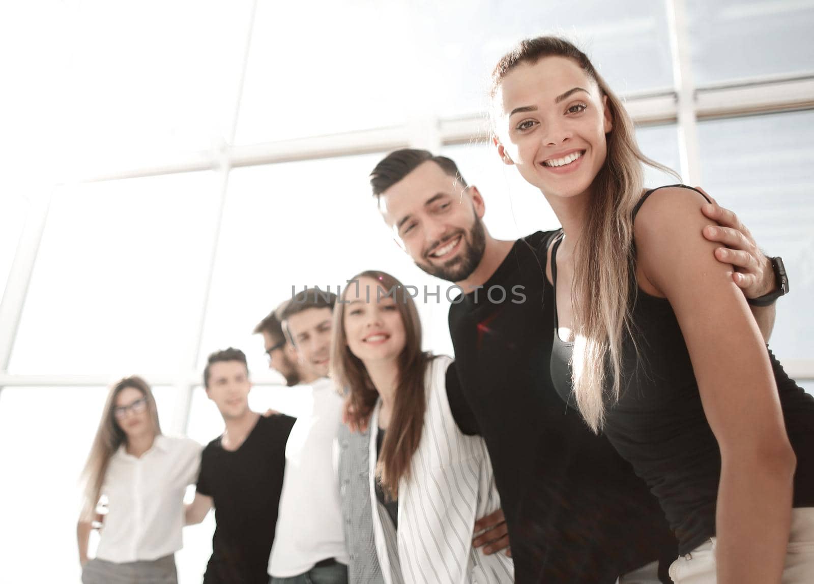 smiling business team standing in the new office.the concept of teamwork