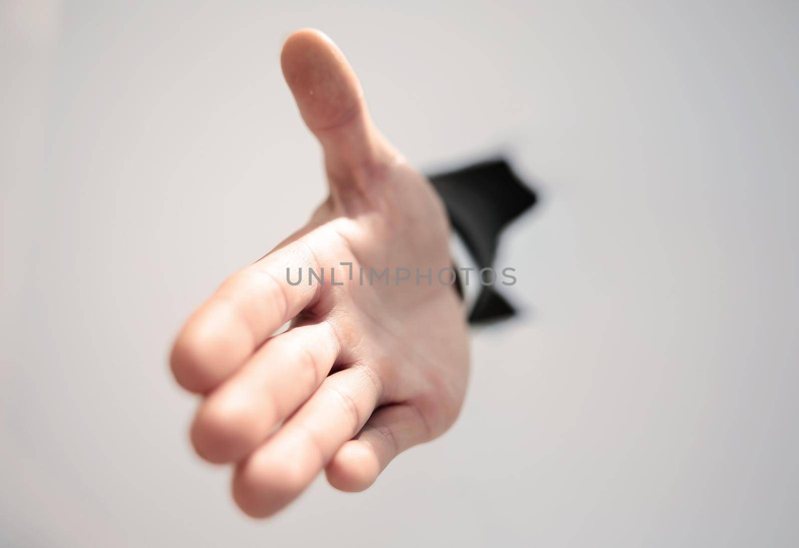 close up. businessman holding out his hand for a handshake.photo with copy space