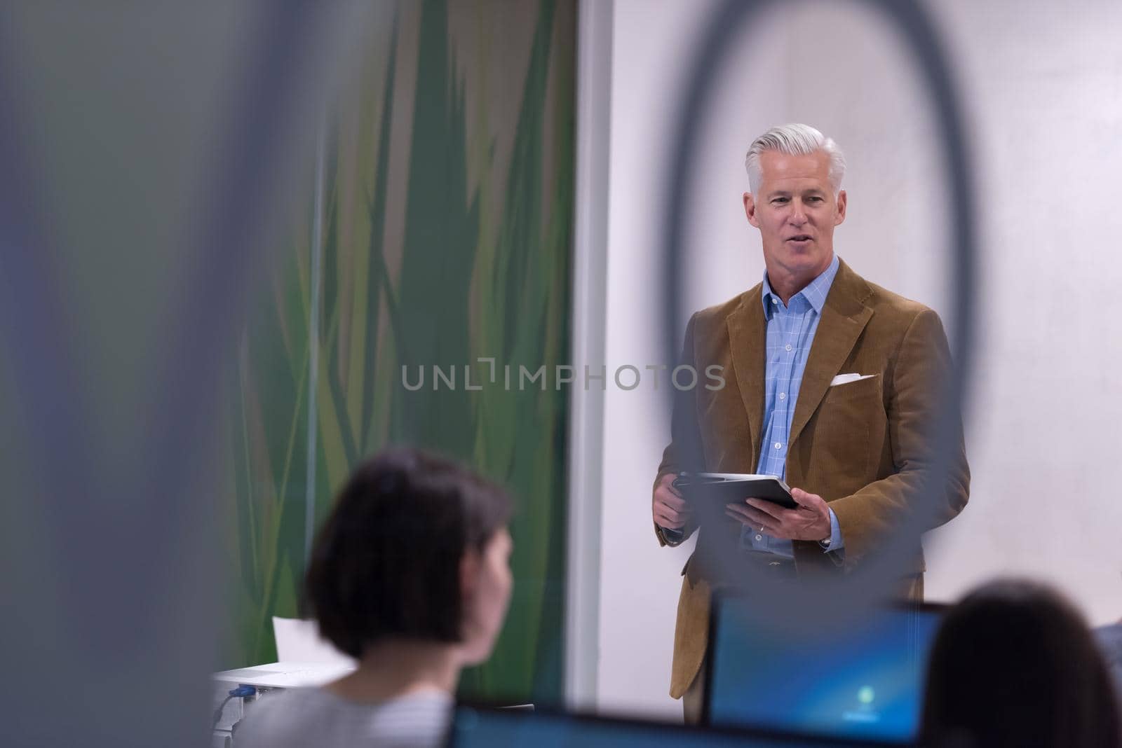 teacher and students in computer lab classroom by dotshock